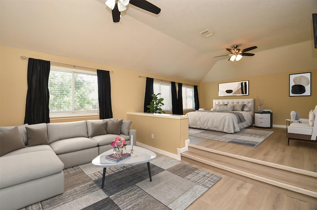 15018 Moss Boulder Ct, Houston, TX 77084 - bedroom featuring wood finished floors, vaulted ceiling, and ceiling fan
