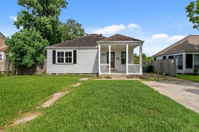 1922 Des Jardines St, Houston, TX 77023 - view of front of property with covered porch and a shingled roof