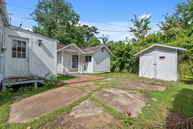 1922 Des Jardines St, Houston, TX 77023 - view of yard with a storage unit and covered porch