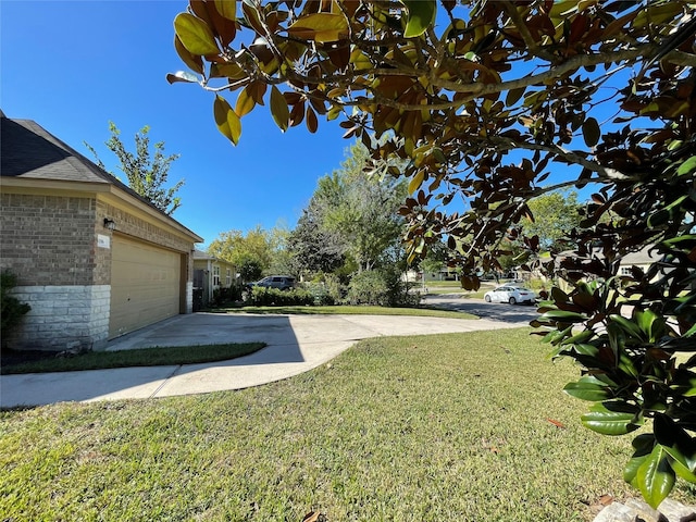 4106 Friar Point Rd, Houston, TX 77047 - view of green lawn with concrete driveway and an attached garage