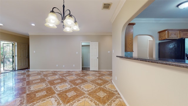 4106 Friar Point Rd, Houston, TX 77047 - unfurnished dining area with a chandelier, arched walkways, light tile patterned flooring, crown molding, and recessed lighting