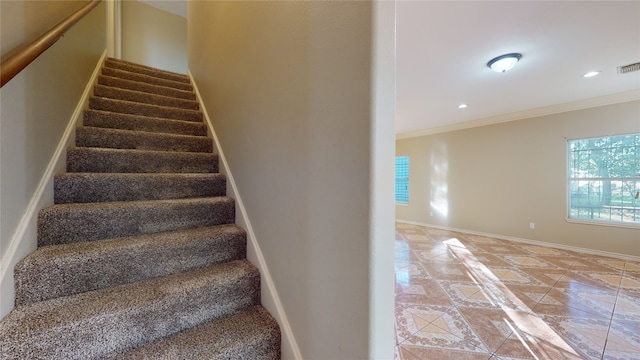 4106 Friar Point Rd, Houston, TX 77047 - stairway featuring tile patterned flooring, crown molding, inlaid floor details, and recessed lighting