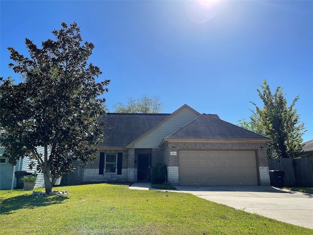 4106 Friar Point Rd, Houston, TX 77047 - view of front of home with brick siding, a garage, concrete driveway, and a shingled roof