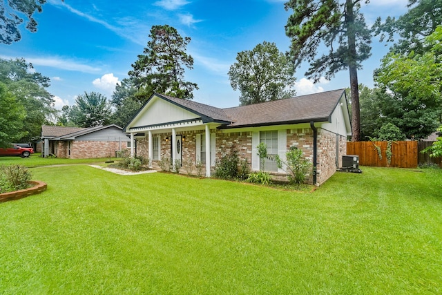 407 Gamewood Dr, Spring, TX 77386 - view of front of property featuring a shingled roof, brick siding, and a porch