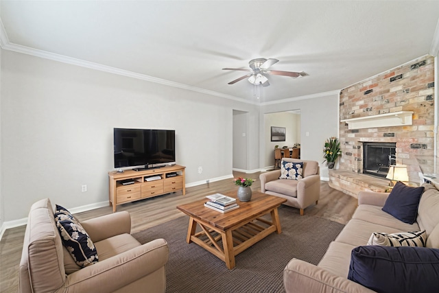 407 Gamewood Dr, Spring, TX 77386 - living room with a ceiling fan, crown molding, wood finished floors, and a brick fireplace