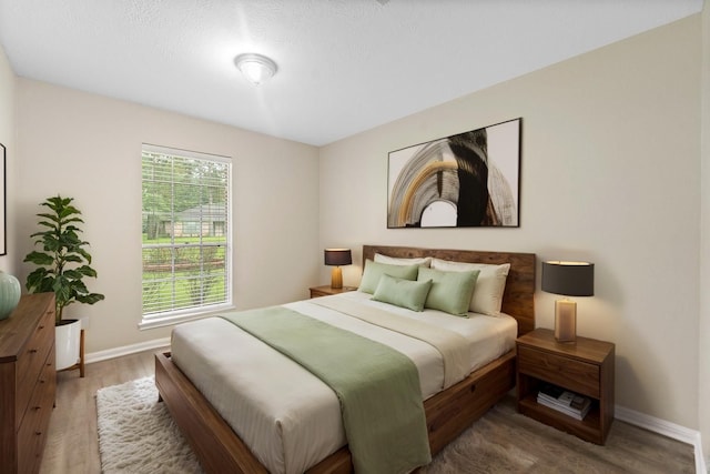 407 Gamewood Dr, Spring, TX 77386 - bedroom featuring baseboards and wood finished floors