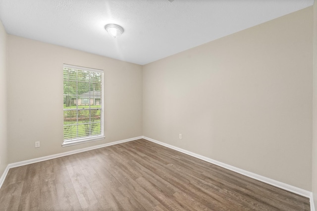 407 Gamewood Dr, Spring, TX 77386 - unfurnished room with wood finished floors and a textured ceiling