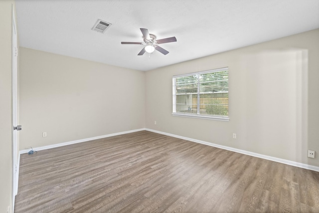 407 Gamewood Dr, Spring, TX 77386 - empty room featuring wood finished floors and ceiling fan