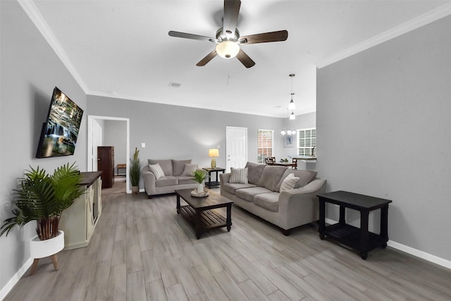 3534 Cork Dr, Houston, TX 77047 - living room with a ceiling fan, light wood-style flooring, and ornamental molding