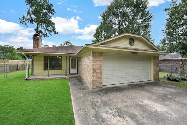 1002 Williams St, Cleveland, TX 77327 - ranch-style house with a chimney, asphalt driveway, brick siding, and a garage