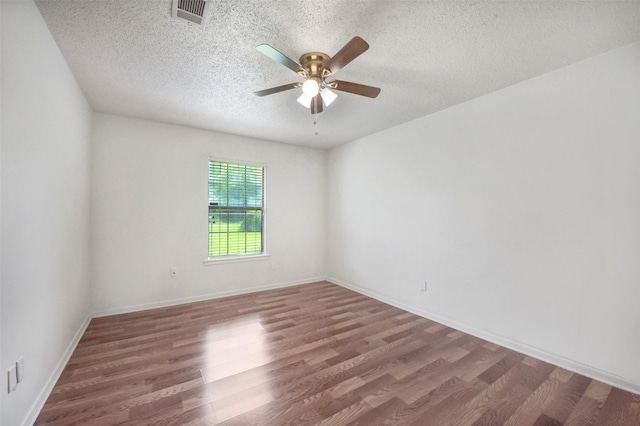 1002 Williams St, Cleveland, TX 77327 - unfurnished room with wood finished floors, ceiling fan, and a textured ceiling