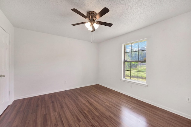 1002 Williams St, Cleveland, TX 77327 - empty room with dark wood-style flooring, a textured ceiling, and ceiling fan
