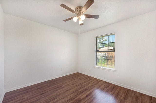 1002 Williams St, Cleveland, TX 77327 - empty room featuring dark wood-style floors and a ceiling fan