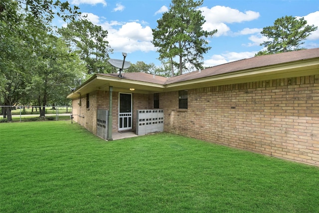 1002 Williams St, Cleveland, TX 77327 - rear view of property featuring brick siding