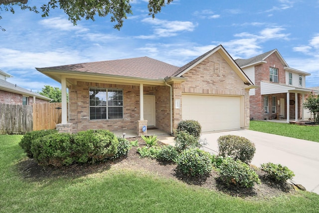 20234 Goss Hollow Ln, Katy, TX 77449 - view of front of house with covered porch, an attached garage, driveway, and brick siding