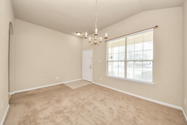 20234 Goss Hollow Ln, Katy, TX 77449 - spare room with vaulted ceiling, a chandelier, and light carpet