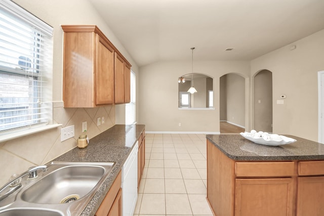 20234 Goss Hollow Ln, Katy, TX 77449 - kitchen with dark countertops, plenty of natural light, light tile patterned floors, tasteful backsplash, and vaulted ceiling