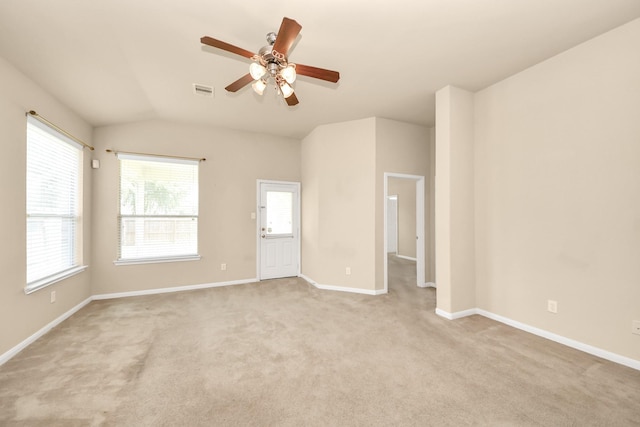 20234 Goss Hollow Ln, Katy, TX 77449 - empty room with a ceiling fan, plenty of natural light, lofted ceiling, and light carpet