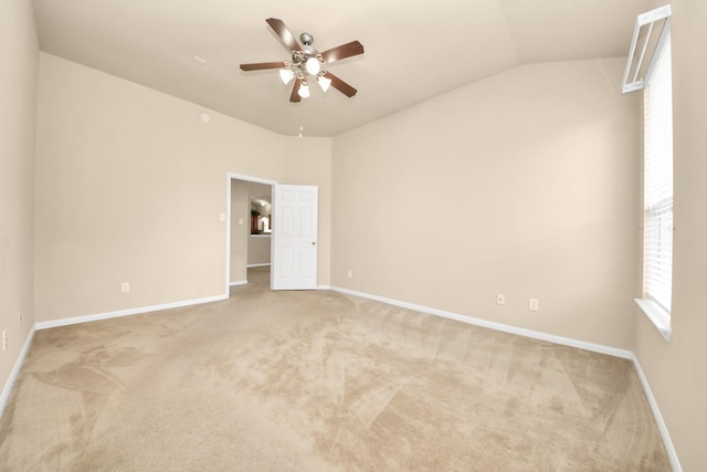 20234 Goss Hollow Ln, Katy, TX 77449 - empty room featuring light carpet, a ceiling fan, and vaulted ceiling