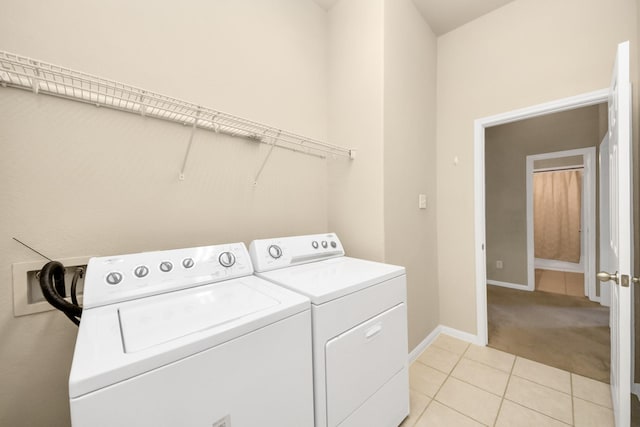 20234 Goss Hollow Ln, Katy, TX 77449 - washroom with washing machine and clothes dryer, light tile patterned floors, and light carpet