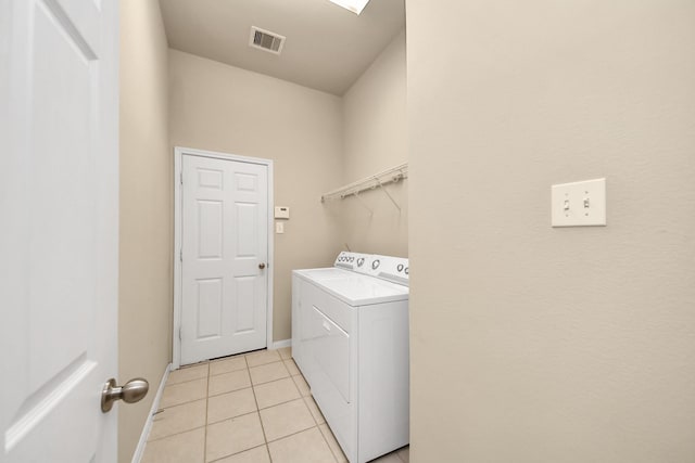 20234 Goss Hollow Ln, Katy, TX 77449 - washroom with washer / clothes dryer and light tile patterned floors