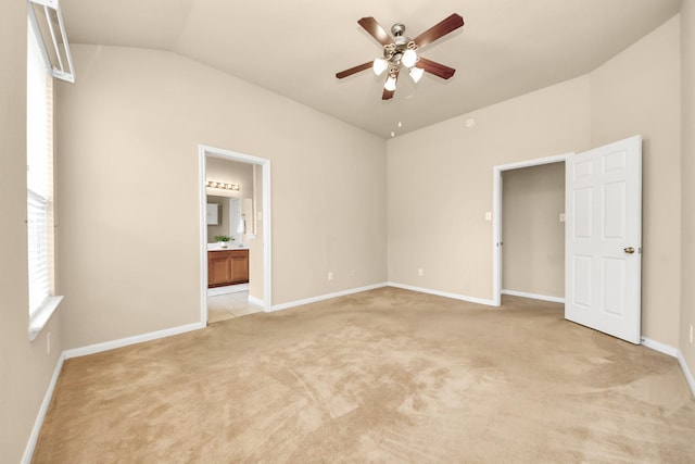 20234 Goss Hollow Ln, Katy, TX 77449 - unfurnished bedroom with lofted ceiling, light colored carpet, connected bathroom, and ceiling fan