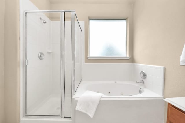 20234 Goss Hollow Ln, Katy, TX 77449 - full bath featuring vanity, a stall shower, and a tub with jets