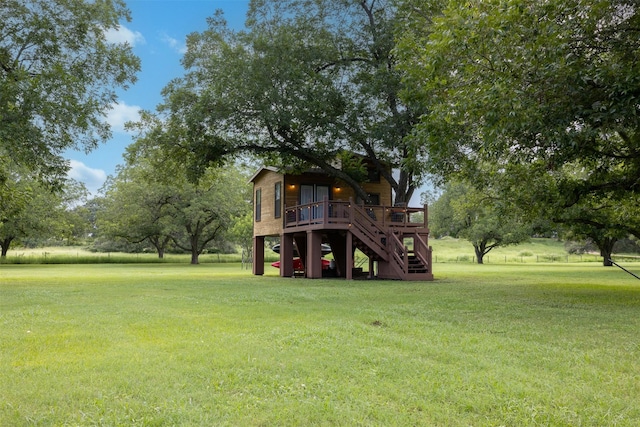 194 2 Mile Ln, Smithville, TX 78957 - view of grassy yard featuring stairs and a deck