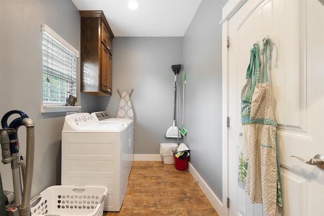 194 2 Mile Ln, Smithville, TX 78957 - washroom featuring cabinet space, washer and clothes dryer, and wood finished floors