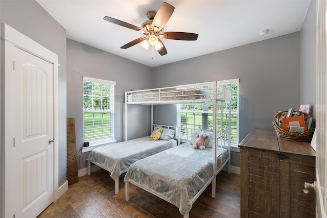 194 2 Mile Ln, Smithville, TX 78957 - bedroom with wood finished floors and ceiling fan