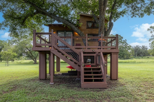 194 2 Mile Ln, Smithville, TX 78957 - view of play area with a deck, stairway, and a lawn