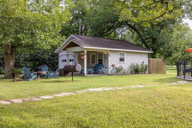 194 2 Mile Ln, Smithville, TX 78957 - view of front facade featuring an outdoor fire pit