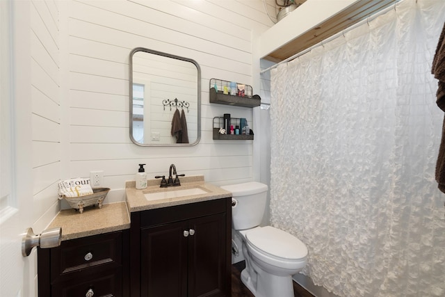 194 2 Mile Ln, Smithville, TX 78957 - bathroom with vanity, wood walls, and a shower with shower curtain