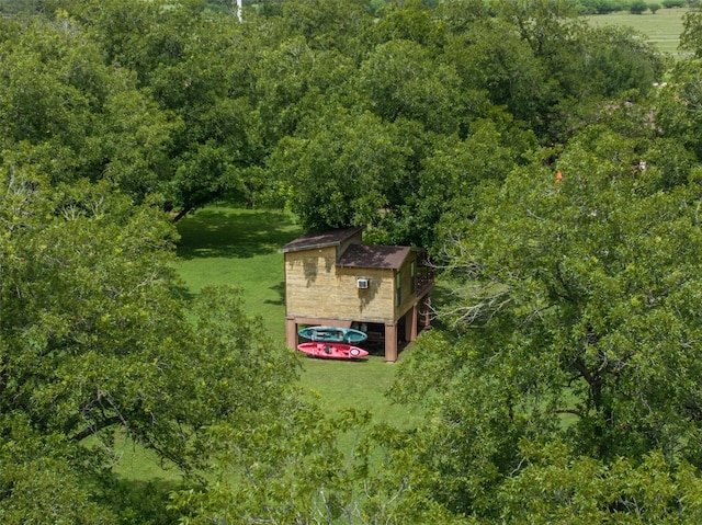 194 2 Mile Ln, Smithville, TX 78957 - aerial overview of property's location with a heavily wooded area