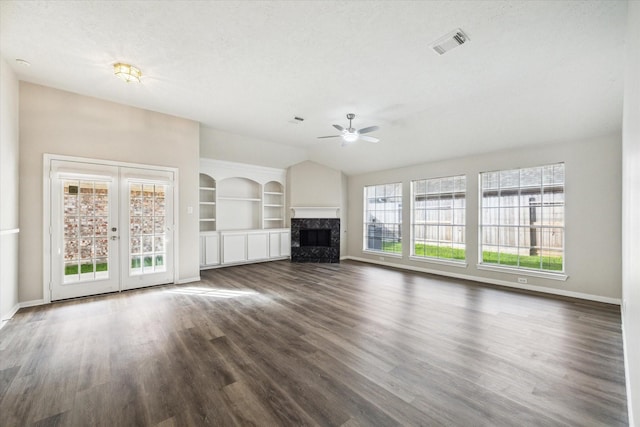 12319 Georgetown Park Ct, Houston, TX 77058 - unfurnished living room with ceiling fan, dark wood finished floors, a premium fireplace, lofted ceiling, and built in shelves