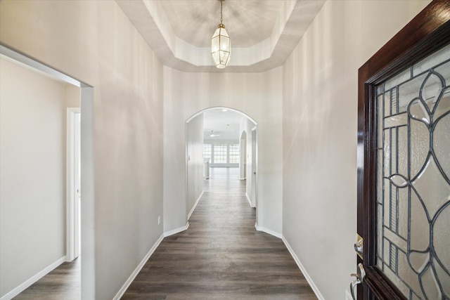 12319 Georgetown Park Ct, Houston, TX 77058 - hallway featuring arched walkways and dark wood-style floors