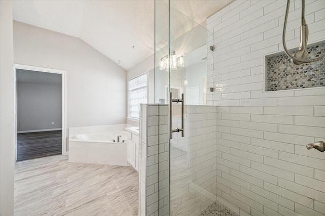 12319 Georgetown Park Ct, Houston, TX 77058 - bathroom with a shower stall, a garden tub, vaulted ceiling, and a chandelier