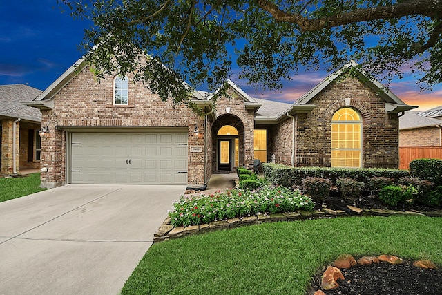 9419 Pecos Pass Ct, Cypress, TX 77433 - traditional-style house with concrete driveway, a garage, brick siding, and a front yard