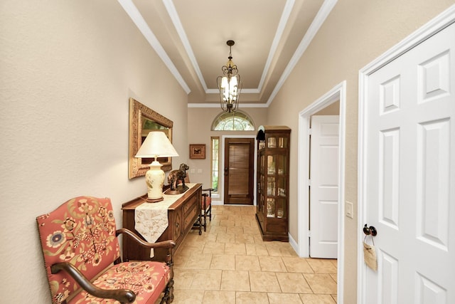 9419 Pecos Pass Ct, Cypress, TX 77433 - entryway featuring ornamental molding, a chandelier, light stone finish flooring, and a raised ceiling