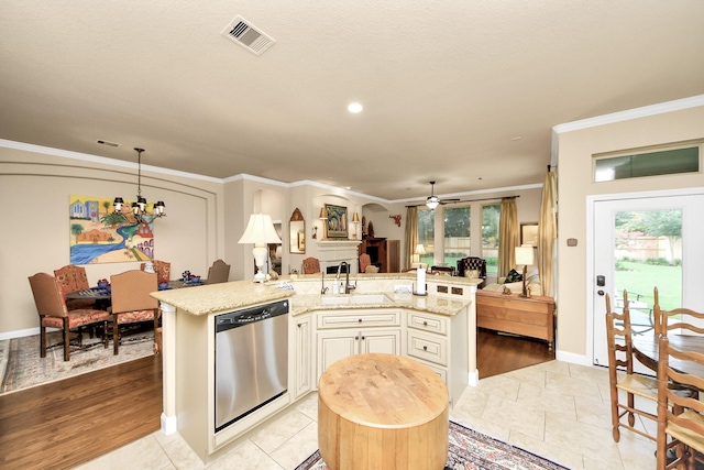 9419 Pecos Pass Ct, Cypress, TX 77433 - kitchen featuring stainless steel dishwasher, an island with sink, open floor plan, a ceiling fan, and crown molding