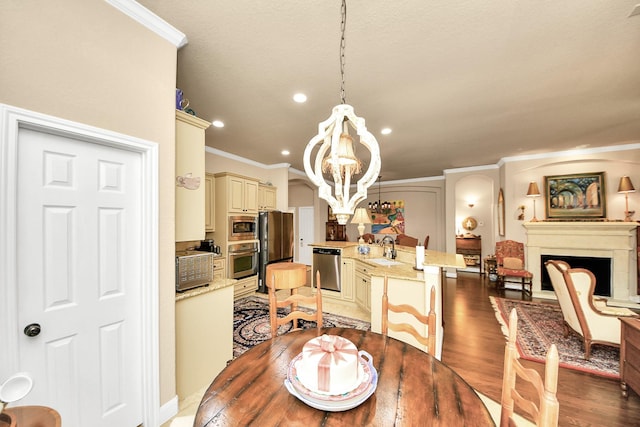 9419 Pecos Pass Ct, Cypress, TX 77433 - dining space with crown molding, a chandelier, light wood-type flooring, a fireplace, and recessed lighting