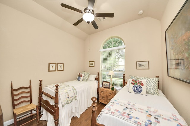 9419 Pecos Pass Ct, Cypress, TX 77433 - bedroom featuring vaulted ceiling, dark wood-style flooring, and a ceiling fan