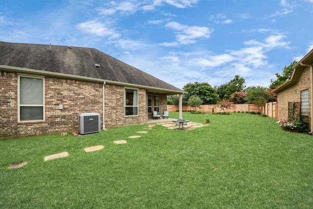9419 Pecos Pass Ct, Cypress, TX 77433 - fenced backyard featuring an outdoor fire pit and a patio