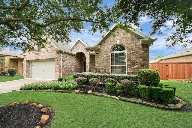 9419 Pecos Pass Ct, Cypress, TX 77433 - traditional-style home featuring an attached garage, brick siding, and driveway