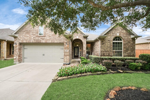 9419 Pecos Pass Ct, Cypress, TX 77433 - traditional-style house featuring driveway, a garage, and brick siding