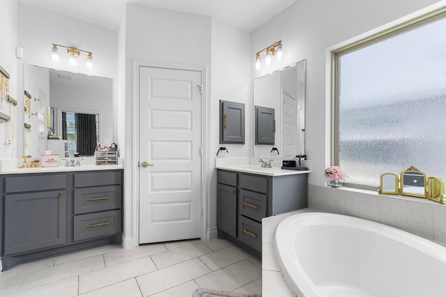 29126 Sage Meadow Trl, Fulshear, TX 77441 - full bath featuring a bath, two vanities, and plenty of natural light