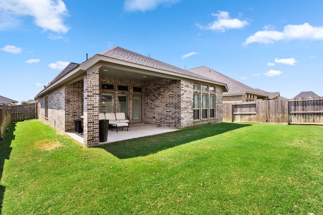 29126 Sage Meadow Trl, Fulshear, TX 77441 - back of house with brick siding, a fenced backyard, a patio, and roof with shingles