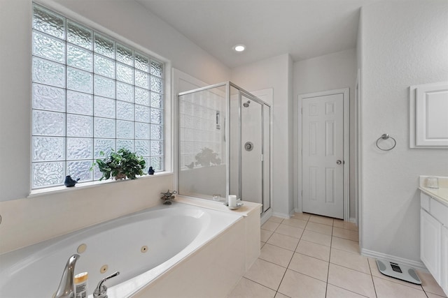 3330 Lake Island Dr, Montgomery, TX 77356 - bathroom with a shower stall, a tub with jets, vanity, and tile patterned floors