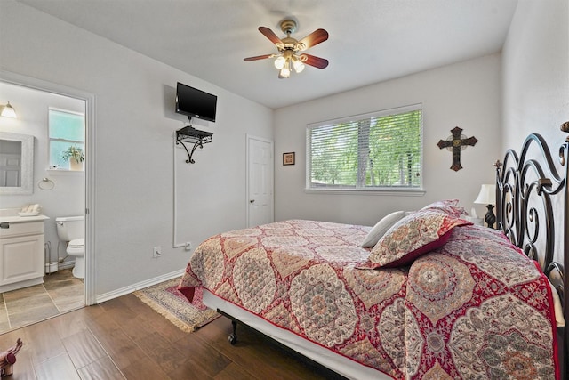 3330 Lake Island Dr, Montgomery, TX 77356 - bedroom featuring light wood finished floors, ensuite bathroom, and ceiling fan