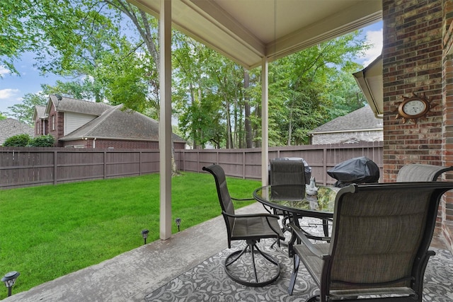 3330 Lake Island Dr, Montgomery, TX 77356 - fenced backyard featuring a patio area, outdoor dining area, and a grill
